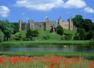 Prints of FRAMLINGHAM CASTLE, Suffolk. View looking East towards the castle from across the mere. Poppies in the foreground Suffolk Prints: Framlingham Castle Print, East View