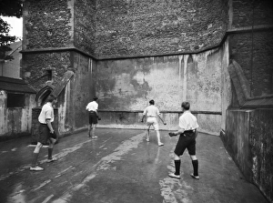 <b class=qtipBold><figcaption>Fives CC46_00458</figcaption></b><br>King's School, The College, Ely, Cambridgeshire. Pupils playing on a fives court. Photographed by Marshall Keene and Company between 1920 and 1939.<br><em>© Historic England Archive</em> Fives CC46_00458