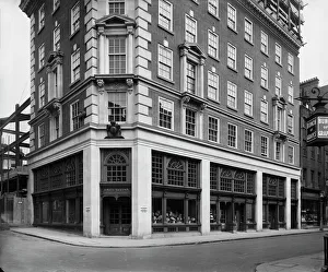 <b class=qtipBold><figcaption>Fortnum and Mason BL29135</figcaption></b><br>Fortnum And Mason, 181 Piccadilly, Greater London. The entrance at the corner of Jermyn Street and Duke Street, with scaffolding visible during rebuilding of the Piccadilly frontage of the department store. The store was rebuilt between 1926 and 1928. The photograph was taken for the architectural practice of Wimperis, Simpson & Guthrie. Photographed by Bedford Lemere and Co in August 1927.<br><em>© Historic England Archive</em> Fortnum and Mason BL29135