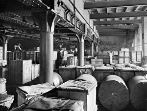 <b class=qtipBold><figcaption>Goods shed, Leicester CC80_00073</figcaption></b><br>London And North West Railway Company Goods Shed, Sussex Street, Leicester. Men moving a crate of produce in the Carmichael's Farm depot at the 'No 2 Shed'. This is on the south-east side of Sussex Street and is now a warehouse. Photographed in 1927 for the London, Midland and Scottish Railway.<br><em>© Historic England</em> Goods shed, Leicester CC80_00073