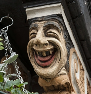 <b class=qtipBold><figcaption>Happy DP152340</figcaption></b><br>The Station Public House, formerly The Stoneleigh Hotel, The Broadway, Stoneleigh, Ewell, Surrey. Built in 1934-5. Detail of a painted corbel bracket depicting a laughing face near the entrance.<br><em>© Historic England Archive</em> Happy DP152340
