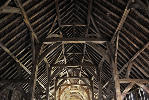 <b class=qtipBold><figcaption>Harmondsworth Great Barn N120005</figcaption></b><br>HARMONDSWORTH GREAT BARN, Greater London. Interior view. Medieval timber framed barn built in 1426-7 by Winchester College. The Great Barn is one of the largest ever known to have been built in England, and one of the most complete and unaltered pre-Dissolution buildings in Britain. "Cathedral of Middlesex" Sir John Betjeman.<br><em>© Historic England</em> Harmondsworth Great Barn N120005