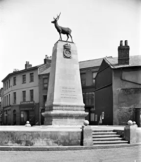<b class=qtipBold><figcaption>Hertford War Memorial BL26700_001</figcaption></b><br>War Memorial, Parliament Square, Hertford. The war memorial in Hertford, Hertfordshire was designed by Sir Aston Webb, RA. It consists of a bronze stag set on a Portland stone plinth. The names of those who died in the Second World War were later also inscribed. Photographed in July 1923 by Bedford Lemere and Company.<br><em>© Historic England Archive</em> Hertford War Memorial BL26700_001