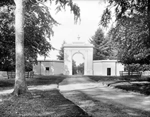 <b class=qtipBold><figcaption>Highclere CC72_00784</figcaption></b><br>Highclere Castle, Entrance Gate, Highclere, Hampshire. A large classical style gateway leading into the park from London Road. Photographed by Henry Taunt, late 19th century.<br><em>© Historic England Archive</em> Highclere CC72_00784