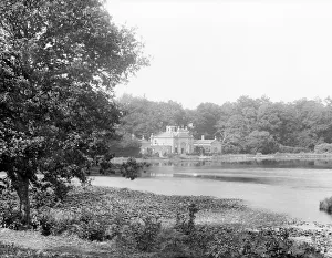 <b class=qtipBold><figcaption>Highclere CC72_01139</figcaption></b><br>Highclere Castle, Lake House, Highclere, Hampshire. The exterior of the building, built as a summer house or fishing pavilion in the mid-19th century, taken across Milford Lake. Photographed by Henry Taunt, late 19th century.<br><em>© Historic England Archive</em> Highclere CC72_01139