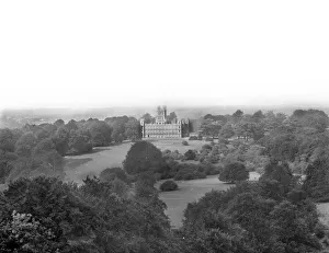 <b class=qtipBold><figcaption>Highclere CC72_01156</figcaption></b><br>Highclere Castle, Highclere, Hampshire. The south side of the mansion, the seat of the Earl of Carnarvon, which was almost totally rebuilt in 1839-42. Previously a big square, classical mansion stood on the site, and before that the palace of the bishops of Winchester. Photographed by Henry Taunt, late 19th century.<br><em>© Historic England Archive</em> Highclere CC72_01156