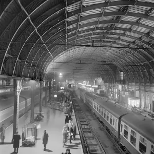 Prints of PADDINGTON STATION, London. Elevated view showing passengers awaiting the arrival of a train on Platform 2 at Paddington railway station. John Gay. Date range: 1960-1972 Iconic Photographers of England - Historic Image Collections: Print of Paddington Station, London