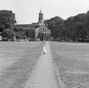 Print of a girl running towards St Anne's Church entrance on Kew Green