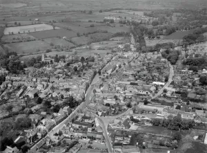 Prints of CHIPPING NORTON, Oxfordshire. Aerial view of the Cotswold market town taken by Harold Wingham, 3rd June 1951 Oxfordshire Prints: Aerial view of Chipping Norton print