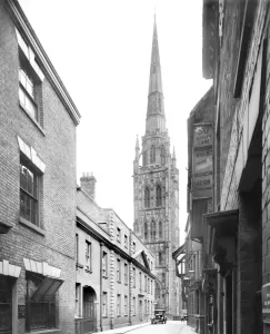 Prints of COVENTRY CATHEDRAL, West Midlands. A view of the Cathedral taken from Pepper Lane. The Cathedral church is named for St Michael Historic Images 1920s To 1940s Prints: Coventry Cathedral Print, a view from Pepper Lane