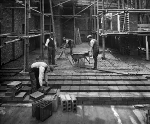 Prints of 8 LLOYDS AVENUE, City Of London. Construction workers laying a hollow pot reinforced concrete floor at number 8 Lloyds Avenue Engineering And Construction Prints: Laying a hollow pot floor, Lloyds Avenue, London Print