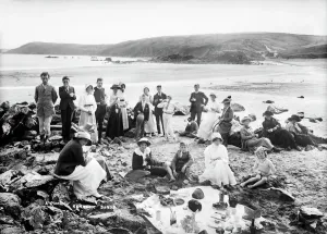 Print of a group having a picnic on the beach at Kennack Sands, Cornwall