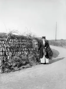 Photos Of Edwardian England Prints: A woman empties a post box in Kerrier, Cornwall