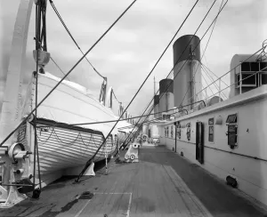 Prints of RMS OLYMPIC, White Star Line. View of the boat deck, looking aft, showing lifeboats and funnels Historic Images 1920s To 1940s Prints: Print of RMS Olympic, a view from the boat deck looking aft