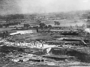 Prints of WEMBLEY STADIUM, London. Construction of the Empire Stadium for the British Empire Exhibition. Aerial photograph taken on 5th September 1922 (produced from a copy negative) Engineering And Construction Prints: Wembley Stadium under construction, 1922 Print