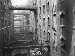 Prints of BUTLERs WHARF, Shad Thames, London. View of the gantries c. 1910. Unknown photographer Related Prints: Butlers Wharf Print, c. 1910, Colour Photograph