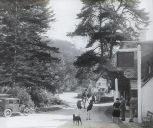Print of a woman on horseback outside the Royal Oak Inn