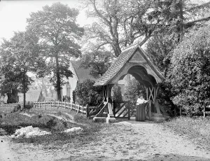 Print of St Mary's Church, Aldworth with woman in lychgate