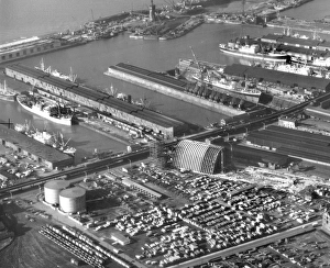 <b class=qtipBold><figcaption>Huskisson Dock OP02540</figcaption></b><br>Huskisson Dock, Regent Road, Liverpool. An aerial view of the docks, with the Tate & Lyle sugar silo under construction near the centre of the picture. Photographed in November 1956 for Tate and Lyle - Tate and Lyle Collection.<br><em>© Historic England Archive</em> Huskisson Dock OP02540