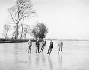 <b class=qtipBold><figcaption>Ice hockey CC73_00049</figcaption></b><br>Medley Port Meadow, Oxford. Local men playing a simple form of ice hockey on the frozen meadow. Photographed by Henry Taunt (active 1860-1922).<br><em>© Historic England Archive</em> Ice hockey CC73_00049