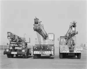 Prints of Grain Power Station, Grain, Isle of Grain, Medway, Kent. Three truck-mounted cranes hired from Elstree Plant lined up on the site of the Isle of Grain Power Station Engineering And Construction Prints: Truck-mounted cranes at the Isle of Grain Power Station Print