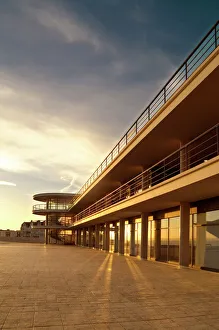 <b class=qtipBold><figcaption>De La Warr Pavilion N061023</figcaption></b><br>DE LA WARR PAVILION, Bexhill on Sea, East Sussex. Exterior view taken from the south east. Late afternoon sunshine reflecting in the glass.<br><em>© Historic England</em> De La Warr Pavilion N061023