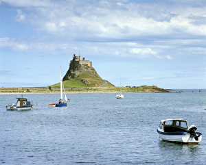 <b class=qtipBold><figcaption>Lindisfarne Castle K040573</figcaption></b><br>LINDISFARNE CASTLE, Holy Island, Northumberland. View from the West looking across harbour with boats in foreground.<br><em>© Historic England</em> Lindisfarne Castle K040573