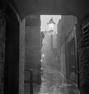 Early 1960s Print: Rainy Alleyway, Theatre Land