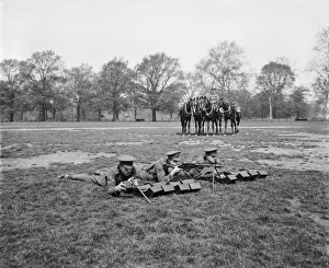 <b class=qtipBold><figcaption>Machine gun troop BL24191_008</figcaption></b><br>British cavalrymen from the 1st Life Guards with a Madsen Machine Rifle. A mounted soldier keeps the horses in the background. During the latter stages of the First World War British cavalry were expected to rapidly exploit break-throughs beyond enemy trench lines. They were equipped with light machine guns that could be deployed quickly. The Madsen was undergoing trials in London in May 1918, at the same time as this photograph was taken by Bedford Lemere and Co.<br><em>© Historic England</em> Machine gun troop BL24191_008