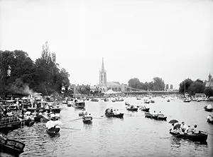 <b class=qtipBold><figcaption>Marlow regatta CC73_00666</figcaption></b><br>MARLOW, Wycombe, Buckinghamshire. A view of the river filled with small row boats and houseboats during the regatta held annually between at least 1855 and 2001 on the River Thames (it has since transferred to Dorney Lake). With All Saints Church and the suspension bridge beyond. Photographed in 1885 by Henry Taunt.<br><em>© Historic England</em> Marlow regatta CC73_00666