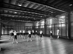 <b class=qtipBold><figcaption>Merchant Taylors School CC46_00614</figcaption></b><br>Merchant Taylors' School, Northwood, Hertfordshire. Physical Education in the gymnasium. Photographed by Marshall Keene and Company between 1933 and 1939.<br><em>© Historic England Archive</em> Merchant Taylors School CC46_00614