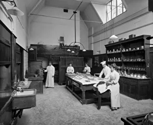 <b class=qtipBold><figcaption>Minley Manor kitchens BL17959A</figcaption></b><br>Minley Manor, Hampshire. Staff in the kitchen at a French chateau style country house that was erected between 1858-60 to the designs of architect Henry Clutton. Photographed by Henry Bedford Lemere in 1903. The Bedford Lemere daybook records that the photograph was commissioned by the owner Laurence Currie to show work carried out by architect Arthur Castings in 1898.<br><em>© Historic England Archive</em> Minley Manor kitchens BL17959A
