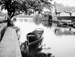 <b class=qtipBold><figcaption>Moored boat CC96_00084</figcaption></b><br>RIVER THAMES, Oxfordshire. Boat moored on the river, perhaps near a lock or weir. This picturesque view shows a boat called the 'Wei-ha-Wei' moored in the foreground. Photographed by Henry Taunt (active 1860 - 1922).<br><em>© Historic England</em> Moored boat CC96_00084
