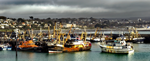 <b class=qtipBold><figcaption>Newlyn Fishing Port N061030</figcaption></b><br>NEWLYN FISHING PORT, Cornwall. Storm clouds settle above the trawlers in the harbour.<br><em>© Historic England</em> Newlyn Fishing Port N061030