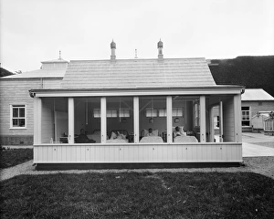 <b class=qtipBold><figcaption>Open air ward BL23137</figcaption></b><br>WOBURN ABBEY, Bedfordshire. The open air isolation ward in the military hospital showing injured soldiers lying in bed. Open-air treatment was used to treat infections and wounds in the early 20th century. Dame Mary Russell, Duchess of Bedford, converted part of Woburn Abbey into a military hospital during the First World War. Photographed by Bedford Lemere and Co in July 1915.<br><em>© Historic England</em> Open air ward BL23137
