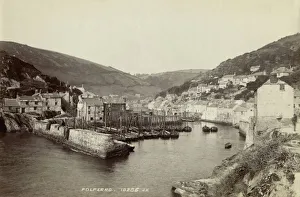 <b class=qtipBold><figcaption>Polperro OP04860</figcaption></b><br>Polperro, Cornwall. The small fishing harbour of Polperro in Lansallos, as seen from the cliff path rising above Scilly Cove. Many wooden fishing sailboats are moored inside the harbour wall, and the village's houses crowd the steep hills either side of the river. Date range: 1850-1900. James Valentine and Sons Limited.<br><em>© Historic England Archive</em> Polperro OP04860