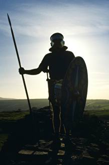 <b class=qtipBold><figcaption>Roman soldier M852248</figcaption></b><br>HADRIAN'S WALL, Northumberland. Roman soldier in silhouette with spear and shield. Ermine Street Guard re-enactor. hadrian<br><em>© Historic England</em> Roman soldier M852248