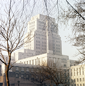 <b class=qtipBold><figcaption>Senate House FF003100</figcaption></b><br>Senate House, Malet Street, Camden, Greater London. A view through winter trees in Russell Square. Constructed 1932-1938 by Charles Holden, on its completion this landmark was the tallest building in London apart from St Paul's Cathedral. Photographed by John Gay.<br><em>© Historic England Archive</em> Senate House FF003100