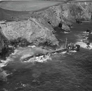 <b class=qtipBold><figcaption>Shipwreck at St Merryn EAW200562</figcaption></b><br>The wreck of the tanker "Hemsley I" at Fox Cove, St Merryn, Cornwall. September 1969. The vessel went ashore here on 12th May 1969 en route from Liverpool to Antwerp. Aerofilms Collection.<br><em>© Historic England</em> Shipwreck at St Merryn EAW200562