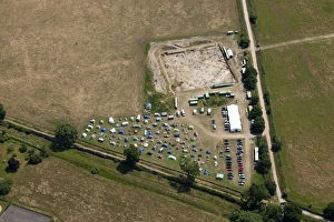 <b class=qtipBold><figcaption>Silchester excavation 27797_009</figcaption></b><br>Silchester, Hampshire. Archaeological excavation in the interior of the Roman town of Calleva Atrebatum, July 2013. Shows work in progress and the campsite for the excavation team. SU6362/230.<br><em>© Historic England</em> Silchester excavation 27797_009