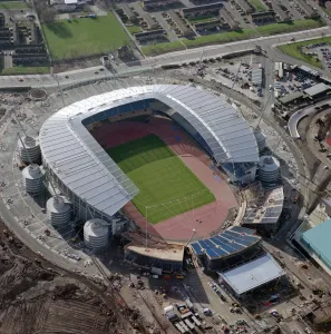 Prints of CITY OF MANCHESTER STADIUM also known as Eastlands, home to Manchester City Football Club since August 2003 Aerial Views of England - Landscapes, Cities and Heritage from Above: Eastlands Stadium Print, Manchester City Football Club's 48,000 seat ground