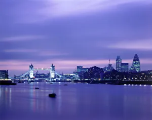 <b class=qtipBold><figcaption>Tower Bridge J060034</figcaption></b><br>TOWER BRIDGE, London. Tower Bridge and the London skyline at nightfall, with the river Thames in the foreground.<br><em>© Historic England</em> Tower Bridge J060034