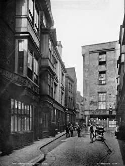 <b class=qtipBold><figcaption>Victorian London OP15922</figcaption></b><br>Cloth Fair, London. A view looking east along Cloth Fair from New Court. Photographed by Augustin Rischgitz, London Stereoscopic Company Limited in the 1890s.<br><em>© Historic England Archive</em> Victorian London OP15922