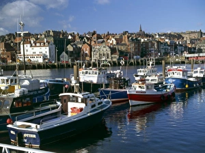 <b class=qtipBold><figcaption>Whitby harbour K011534</figcaption></b><br>WHITBY, North Yorkshire. Inner harbour and boats from east side looking towards the town centre.<br><em>© Historic England</em> Whitby harbour K011534