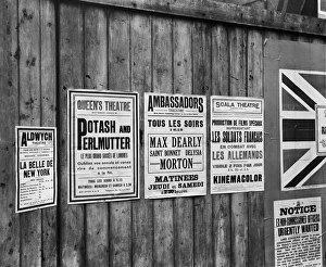 <b class=qtipBold><figcaption>World War I Propaganda BL22847</figcaption></b><br>Playbills on a hoarding, London. Propaganda posters & adverts for propaganda films, in both English & French languages. Bedford Lemere, 1914.<br><em>© Historic England</em> World War I Propaganda BL22847