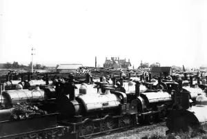 Print of Broad Gauge locomotives at the Swindon dump, 1892