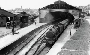 Prints of A view of Penzance station, Cornwall, c.1940, showing Castle Class locomotive No. 5024, Carew Castle, sitting at the platform with the town of Penzance visible in the background Locomotive Prints: Penzance Station Print, c. 1940, Cornwall