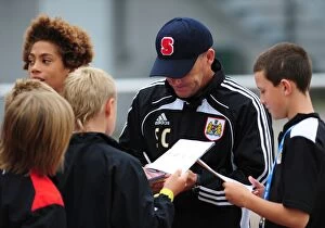 Images Dated 19th July 2010: Bristol City Manager, Steve Coppell signs autographs for the academy players