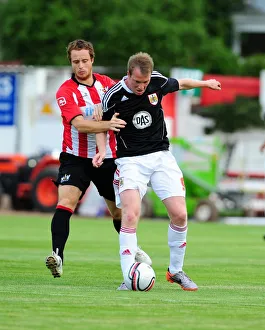 Bristol Citys David Clarkson battles for the ball with Ryan Harley Bristol Citys David Clarkson battles for the ball with Ryan Harley