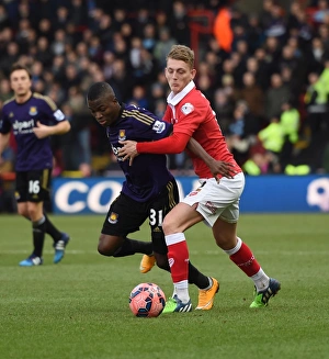 Bristol Citys George Saville tussles with West Hams Enner Valencia in the FA Cup Bristol Citys George Saville tussles with West Hams Enner Valencia in the FA Cup